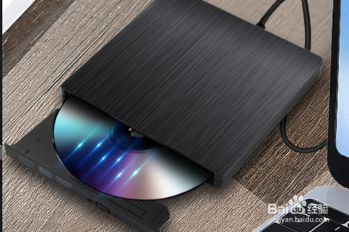 电脑如何放光盘？